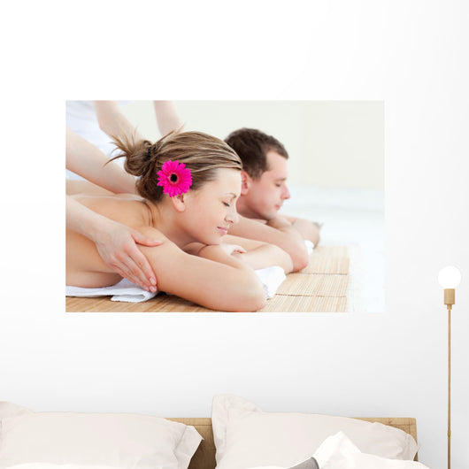 Relaxed couple having a back massage Wall Mural