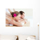 Relaxed couple having a back massage Wall Mural