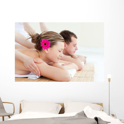 Relaxed couple having a back massage Wall Mural
