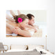 Relaxed couple having a back massage Wall Mural