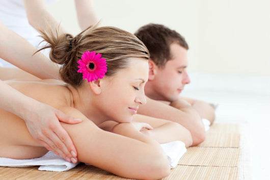 Relaxed couple having a back massage Wall Mural