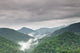 Early morning fog and cloud mountain valley landscape Wall Mural