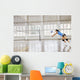 girls playing volleyball indoor game Wall Mural