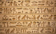 hieroglyphs carved on the stone Wall Mural