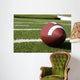 Closeup of American Football on Field Wall Mural