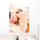 Relaxed Young Man Receiving a Back Massage with Hot Stone Wall Mural