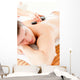 Relaxed Young Man Receiving a Back Massage with Hot Stone Wall Mural
