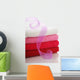 Stack of clean towels and pink ribbon Wall Mural