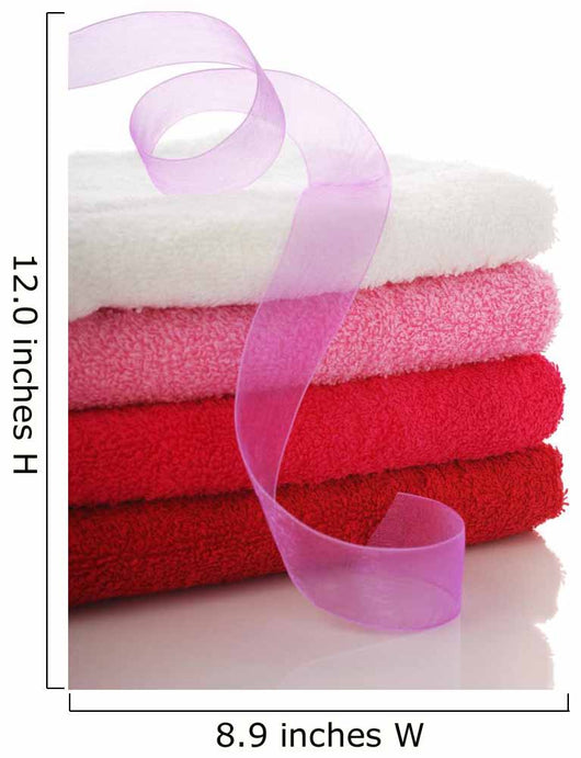 Stack of clean towels and pink ribbon Wall Mural