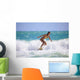 Teenage Girl in a Yellow Bikini Surfing Wall Mural