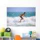Teenage Girl in a Yellow Bikini Surfing Wall Mural