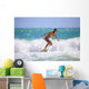 Teenage Girl in a Yellow Bikini Surfing Wall Mural