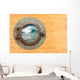 Antique Porthole With View of Crashing Waves Wall Mural