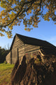 Autumn landscape with barn and goat Wall Mural