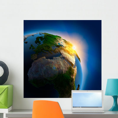 Sunrise over Earth Outer shown on a wall