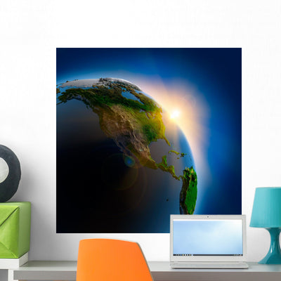 Sunrise over Earth Outer shown on a wall