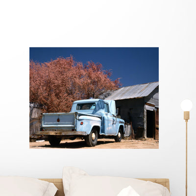 Old and Rusty Chevrolet Wall Mural shown on a wall