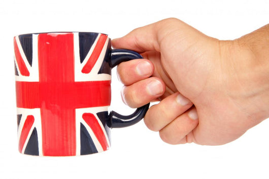Hand Holding British Mug Wall Mural