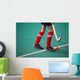 Field hockey girl with stick in hands Wall Mural