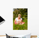 Mother nursing baby on meadow Wall Mural