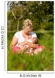 Mother nursing baby on meadow Wall Mural