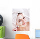 Girl with clay facial mask. Wall Mural