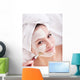 Girl with clay facial mask. Wall Mural
