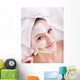 Girl with clay facial mask. Wall Mural