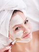 Girl with clay facial mask. Wall Mural