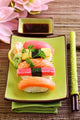 Japan traditional food sushi on green plate Wall Mural