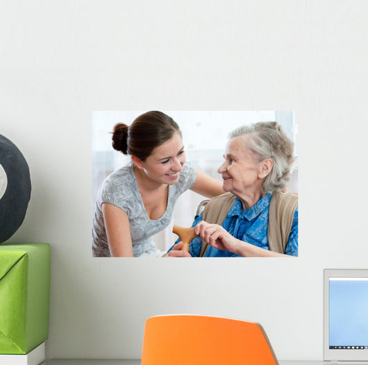 Senior woman with her home caregiver Wall Mural