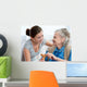 Senior woman with her home caregiver Wall Mural