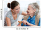 Senior woman with her home caregiver Wall Mural