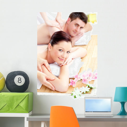 Delighted young couple receiving a back massage Wall Mural