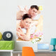 Delighted young couple receiving a back massage Wall Mural
