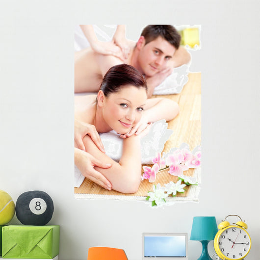 Delighted young couple receiving a back massage Wall Mural