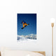 Snowboarder in Orange Jumping High Wall Mural