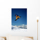 Snowboarder in Orange Jumping High Wall Mural
