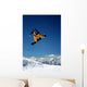 Snowboarder in Orange Jumping High Wall Mural