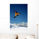 Snowboarder in Orange Jumping High Wall Mural