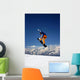 Snowboarder in Orange Jumping High Wall Mural
