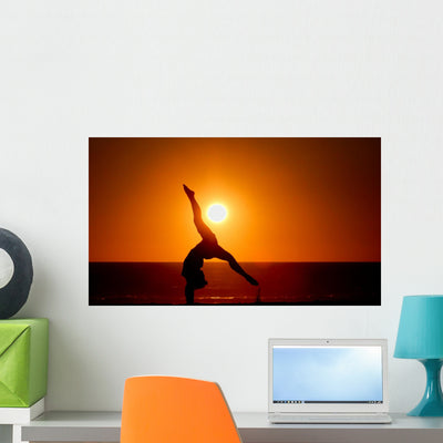 Sunset Silhouette Gymnast Beach Wall Mural shown on a wall