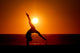 sunset silhouette gymnast on beach Wall Mural