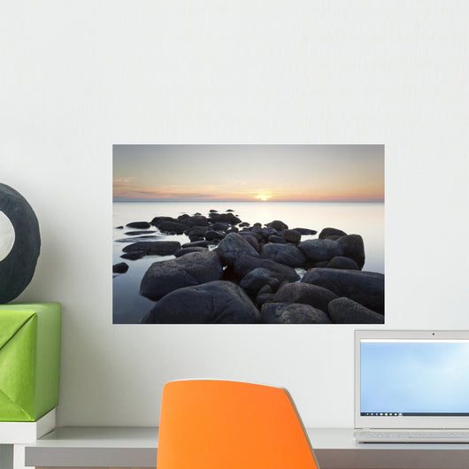 Rocks leading to open sea. Wide angle photo Wall Mural