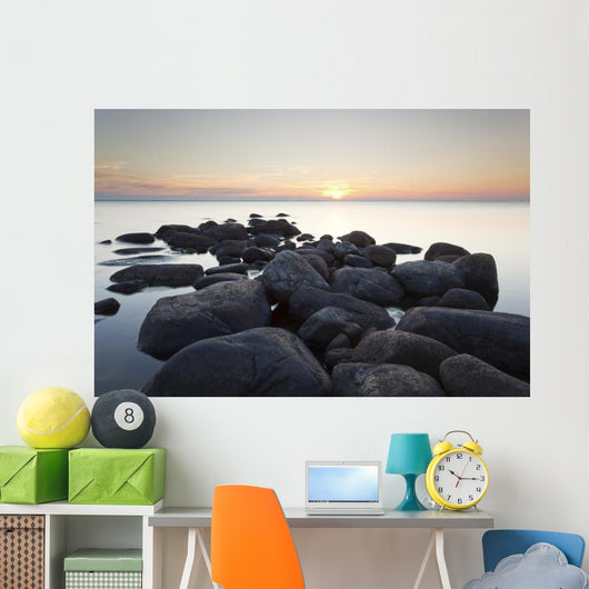 Rocks leading to open sea. Wide angle photo Wall Mural