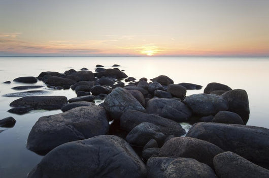 Rocks leading to open sea. Wide angle photo Wall Mural