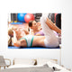 Women Doing Stretching Exercises In Gym Wall Mural