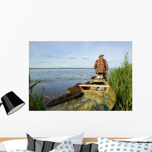 Hunter with his kayak Wall Mural