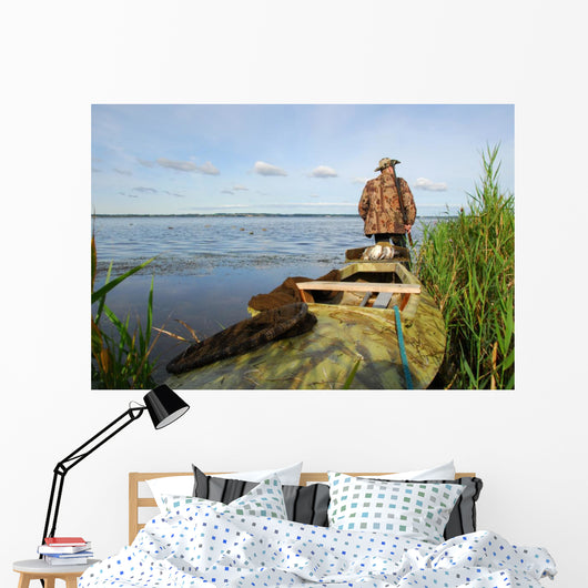 Hunter with his kayak Wall Mural