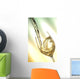 Pour white vine into glass with light background. Wall Mural
